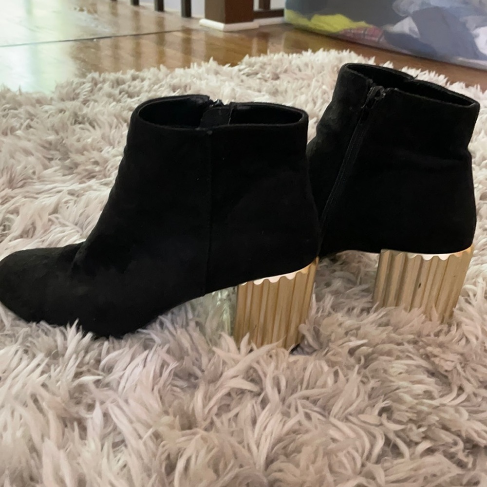 Black booties with gold heels
